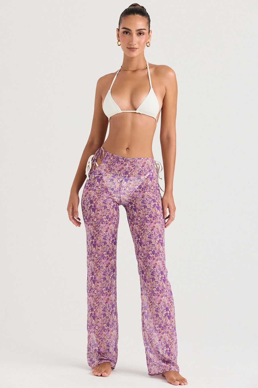 pantaloni con ritagli floreali viola